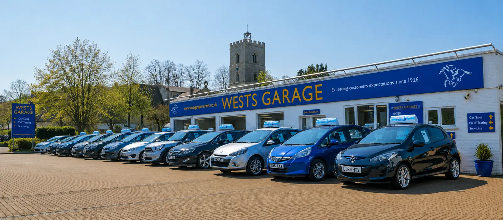 Wests Garage today with forecourt of vehicles